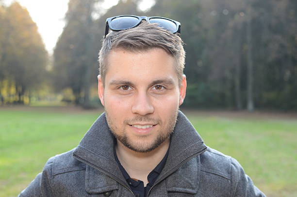 istock Young man in autumn park 465255695