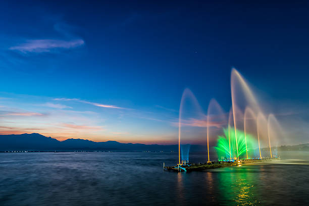 istock fountain on water in twilight time 465256293