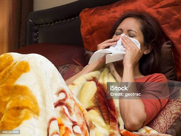 Woman Sick Of Colds On Bed Stock Photo - Download Image Now - Bed - Furniture, Illness, Coughing