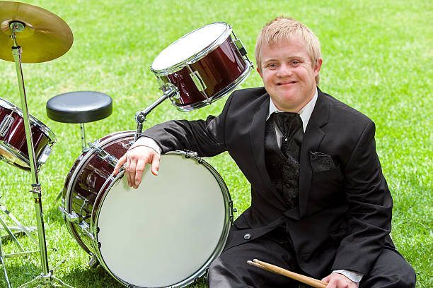 istock Young handicapped drummer next to drums. 465259023