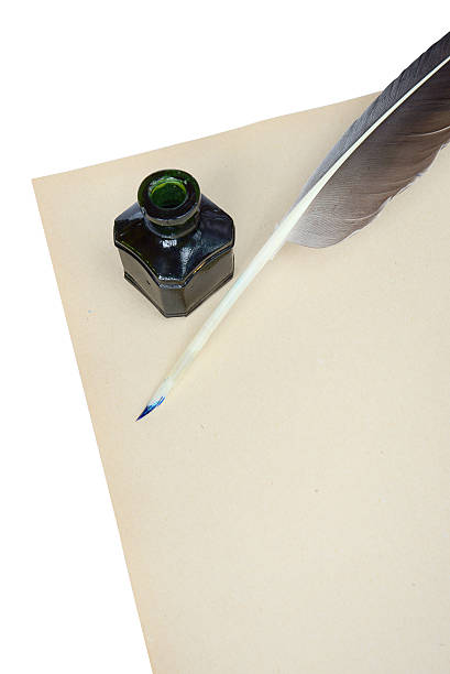 istock feather, ink and sheet of paper 465259821