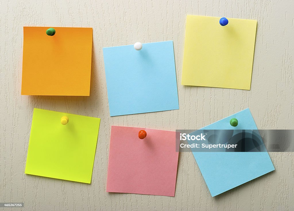 Post it notes and pins A different color post it notes and pins Backgrounds Stock Photo