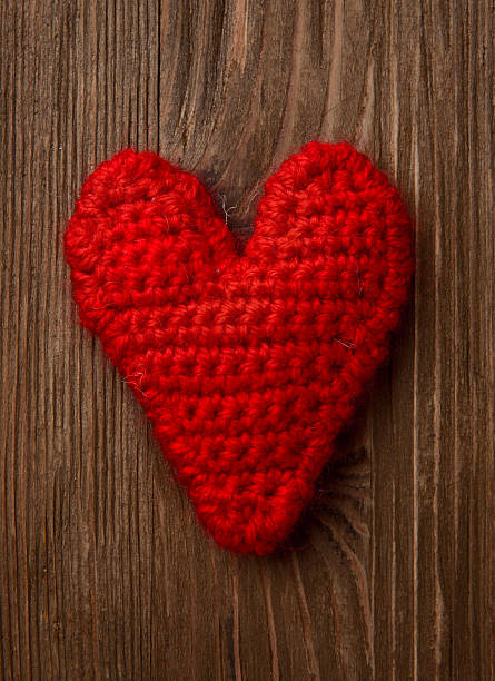 istock red heart on wooden background 465267427