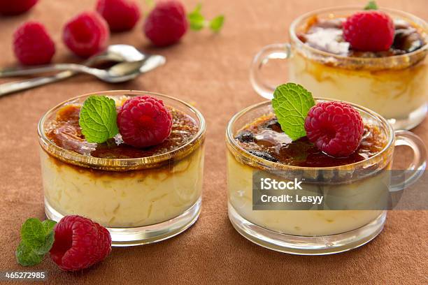 Creme Bruleewith Raspberries And Mint Stock Photo - Download Image Now - Baked, Caramel, Cooking