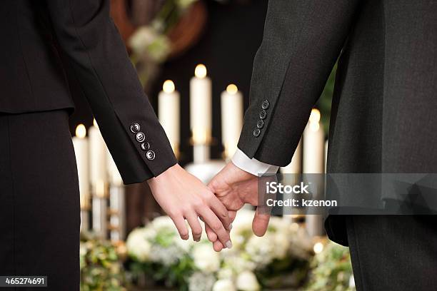 People At A Funeral Holding Hands Stock Photo - Download Image Now - Funeral, Funeral Parlor, Undertaker