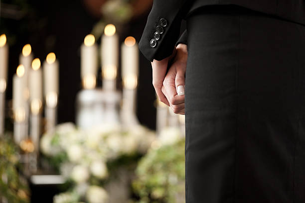 istock Woman in black mourning at a funeral 465274711