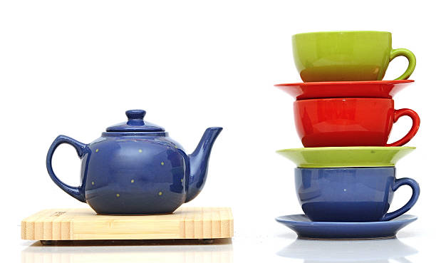 istock Tea cups with teapot isolated on white 465276065