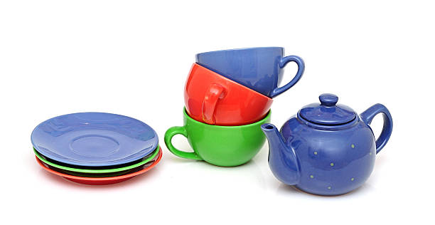 istock colorful tea cups with teapot isolated on white 465276109