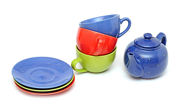 istock colorful tea cups with teapot isolated on white 465276127