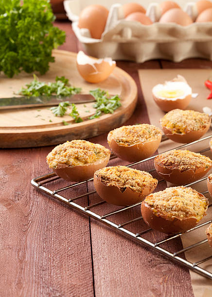 istock Baked eggs, stuffed with ham and parsley 465278875