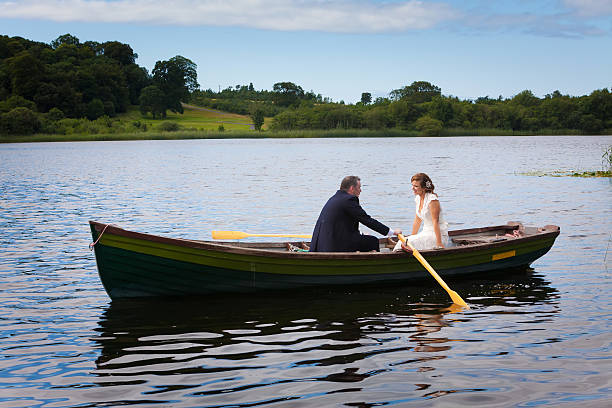 newlywed couple on lake newly wed couple taking a break at a lake couple punting stock pictures, royalty-free photos & images