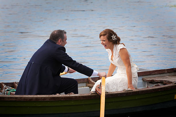 newlywed couple on lake newly wed couple taking a break at a lake couple punting stock pictures, royalty-free photos & images