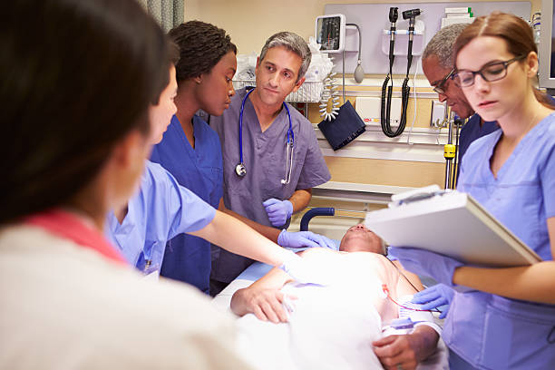 istock Medical Team Working On Patient In Emergency Room 465284979