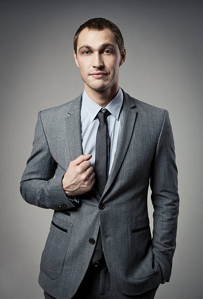 istock Cool businessman portrait on grey background 465285053
