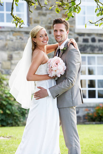 istock Romantic Bride And Groom Embracing Outdoors 465285381