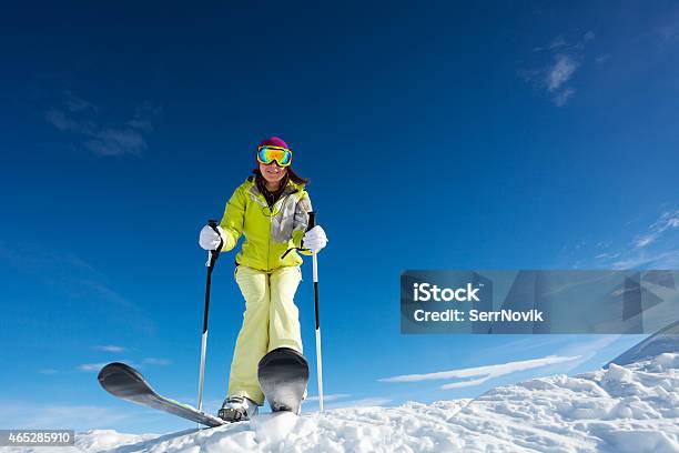 View From Below Of Woman In Mask Holding Poles Stock Photo - Download Image Now - 2015, Activity, Adult