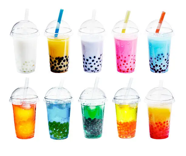 Different sorts of Boba Bubble Tea Cocktail. Standing in a row isolated on white background.