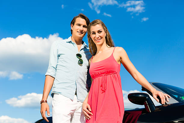 istock Young couple with cabriolet in summer on day trip 465289007