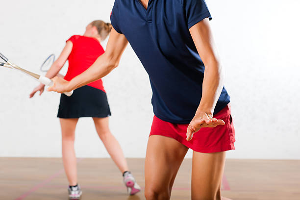 istock Squash racket sport in gym, women competition 465289542