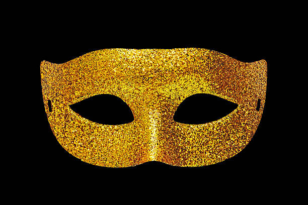 Golden theater mask on black background