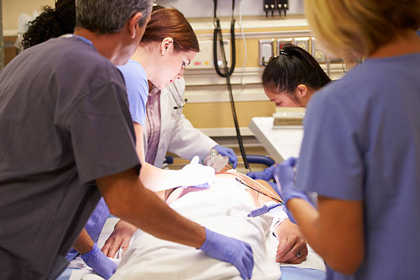 istock Medical Team Working On Patient In Emergency Room 465289857