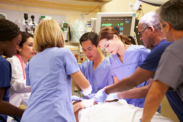 istock Medical Team Working On Patient In Emergency Room 465289921