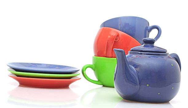 istock colorful tea cups with teapot isolated on white 465290569