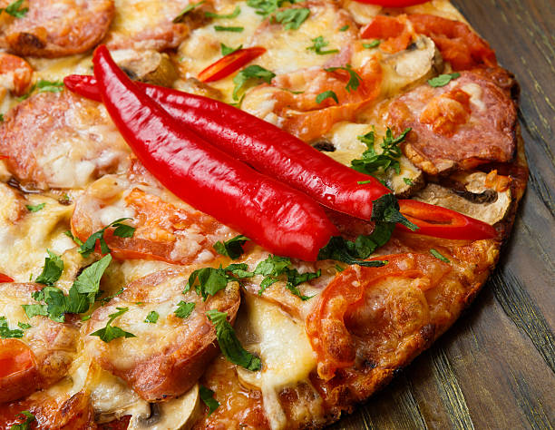istock Delicious pizza with salami and chili peppers 465292814
