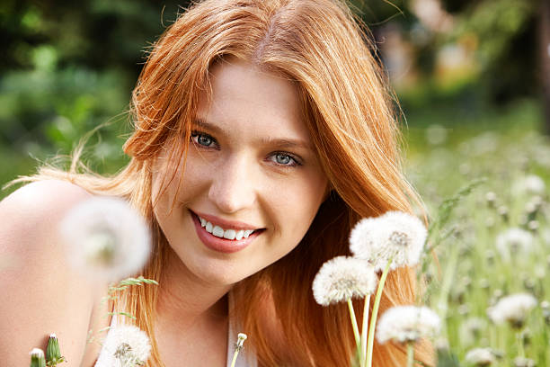 istock Woman and dandelions 465293094