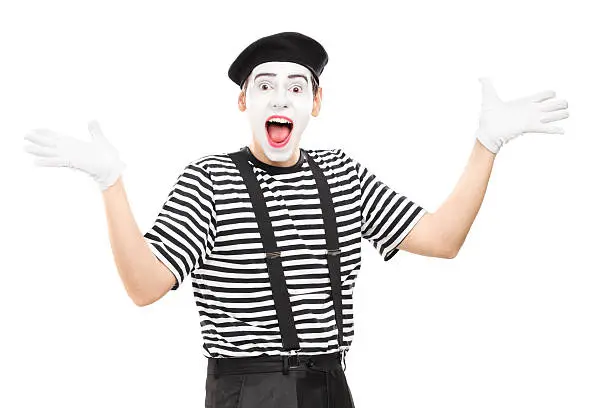 Mime artist gesturing joy with his hands isolated on white background