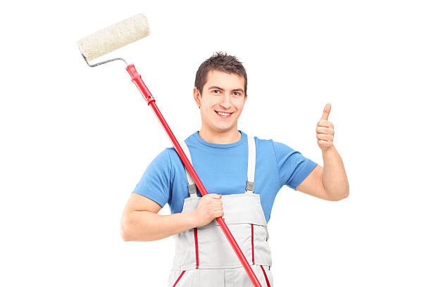 istock Male painter holding a roller and giving thumb up 465295661