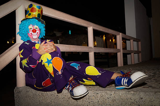 istock Clown sitting in the park 465297064