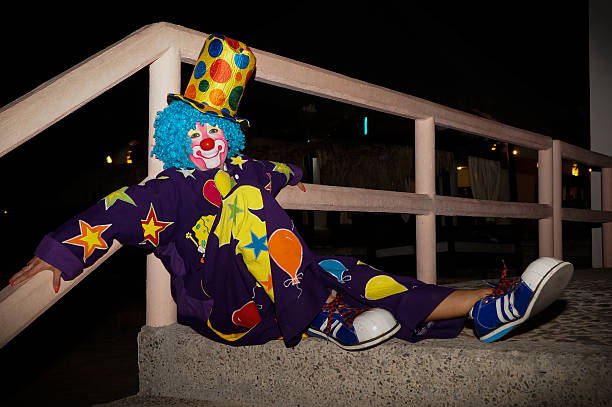 istock Clown sitting in the park 465297068