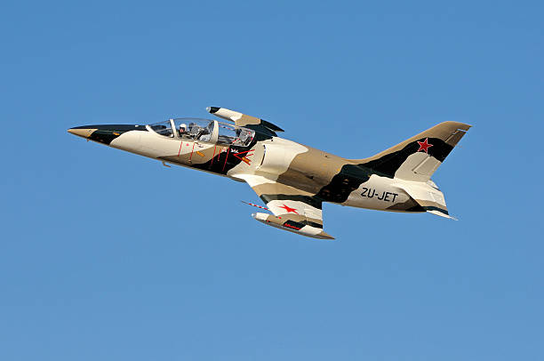 Aero L-39 Albatros fly-by Bloemfontein, South Africa - May 4, 2013: An Aero L-39 Albatros fly-by at an airshow at the Tempe Airport near Bloemfontein. It is a jet trainer aircraft developed in Czechoslovakia.  v aero l 39 albatros stock pictures, royalty-free photos & images