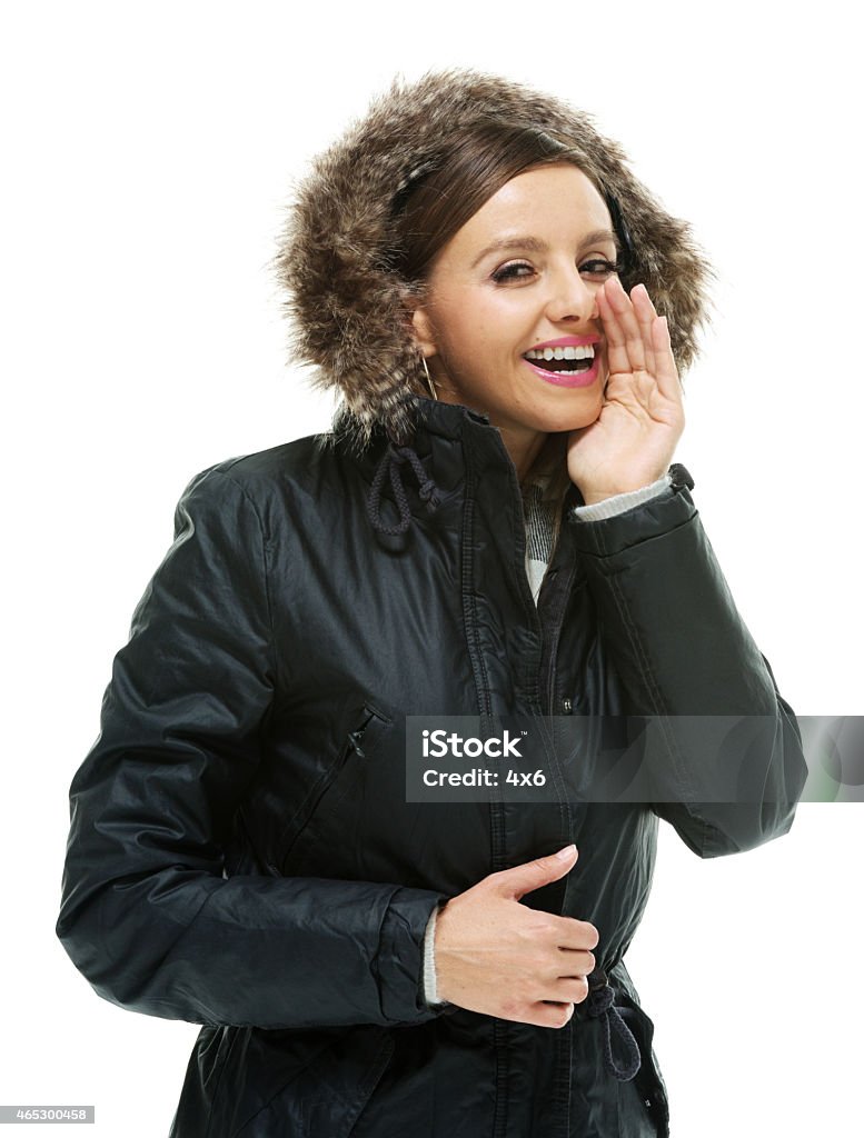 Cheerful woman whispering Cheerful woman whisperinghttp://www.twodozendesign.info/i/1.png 2015 Stock Photo