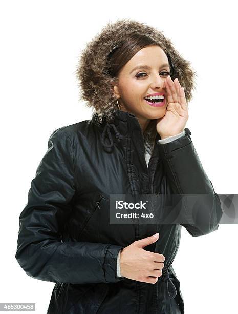 Cheerful Woman Whispering Stock Photo - Download Image Now - 2015, 30-34 Years, 30-39 Years