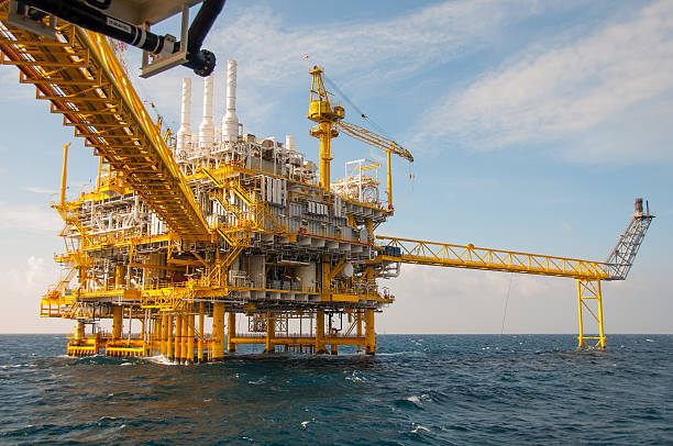 istock Oil and rig platform with blue sky 465305891