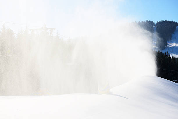 The slope of Bukovel ski resort with working snow machine, Ukraine