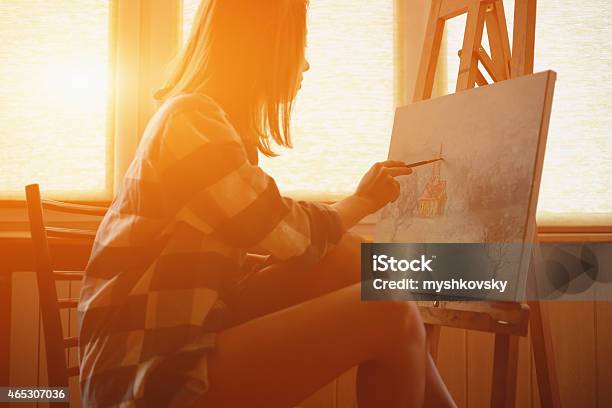 Young Woman Painting Landscape Near The Window Stock Photo - Download Image Now - One Woman Only, Women, Art