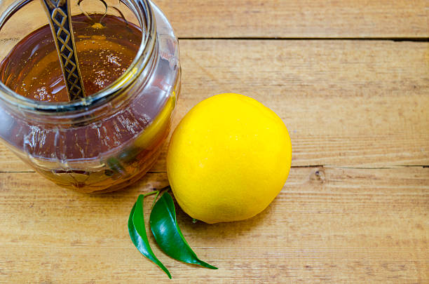 istock Whole lemon and honey in a jar 465307294