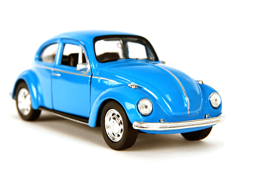 Izmir, Turkey, March 03, 2015: Vintage toy car in front of a white background. The Volkswagen Type 1, widely known as the Volkswagen Beetle, was an economy car produced by the German auto maker Volkswagen (VW) from 1938 until 2003