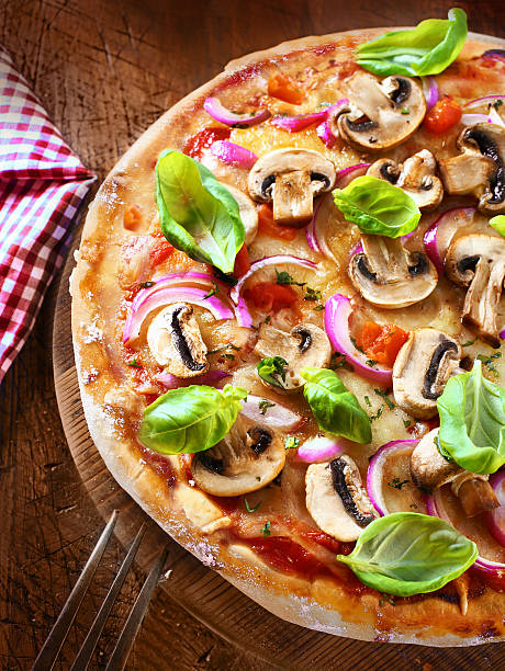 istock Tasty mushroom and onion pizza 465309923