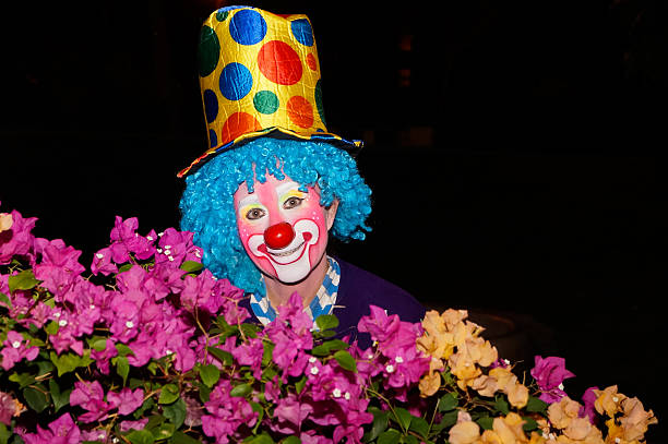 istock Clown at night with flowers. 465310978