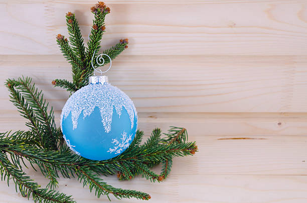 istock Blue Christmas ornament on a wooden table 465311598