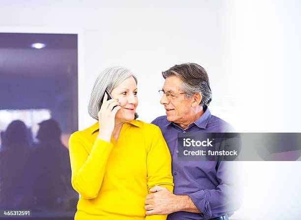 Senior Couple Using Smartphone At Home Stock Photo - Download Image Now - 50-59 Years, Active Seniors, Adult