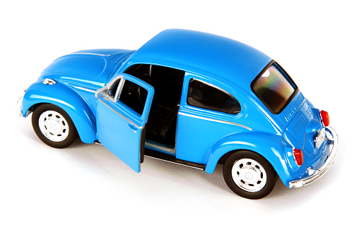Izmir, Turkey, March 03, 2015: Vintage toy car in front of a white background. The Volkswagen Type 1, widely known as the Volkswagen Beetle, was an economy car produced by the German auto maker Volkswagen (VW) from 1938 until 2003