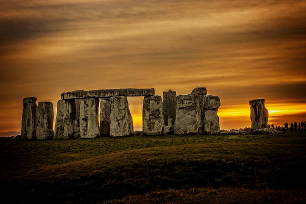 istock Stonehenge with tourists at sunset 465314919