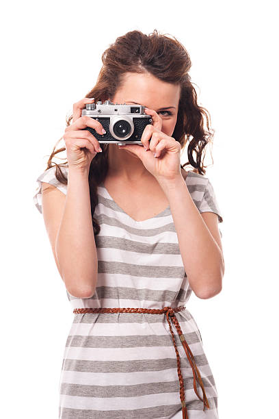 istock Brunette young woman taking photo by retro camera 465314985