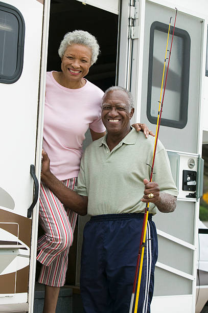 istock Senior couple on steps of a caravan 465318707