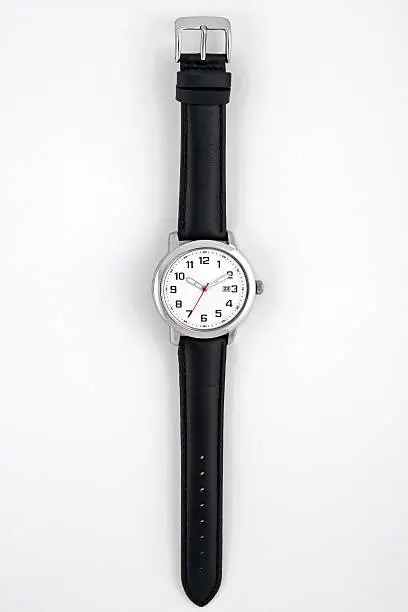 Photo of Men's wristwatch with black leather band on white background